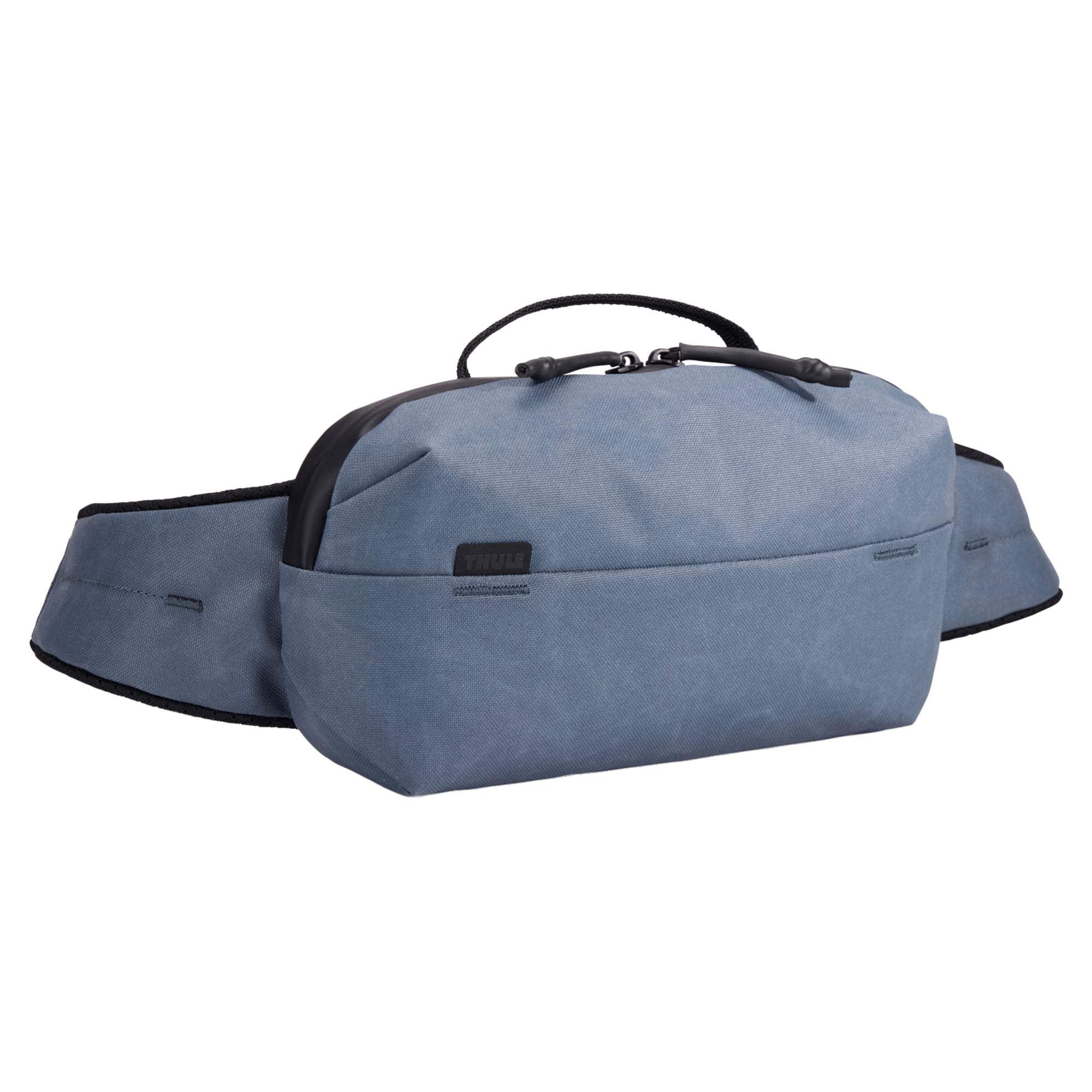 Hüfttasche aus gewachstem Canvas Die Aion Sling Bag in Blau ist eine moderne Hüfttasche